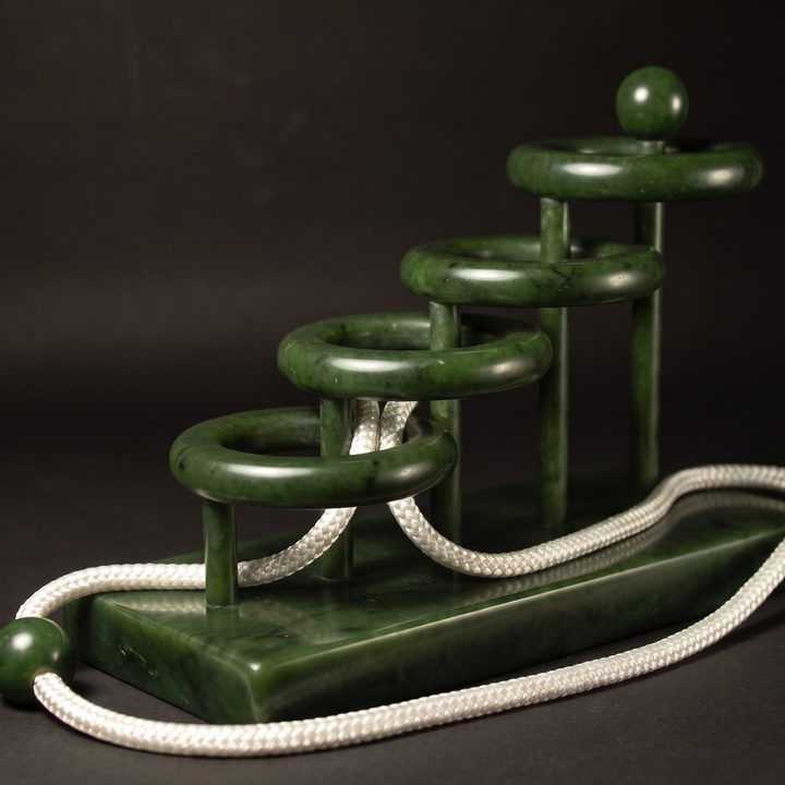 Four Infinities in nephrite jade